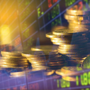 Stack Of Money Coin And Double Exposure Of Graph And Rows Of Coins For Finance And Business Concept
