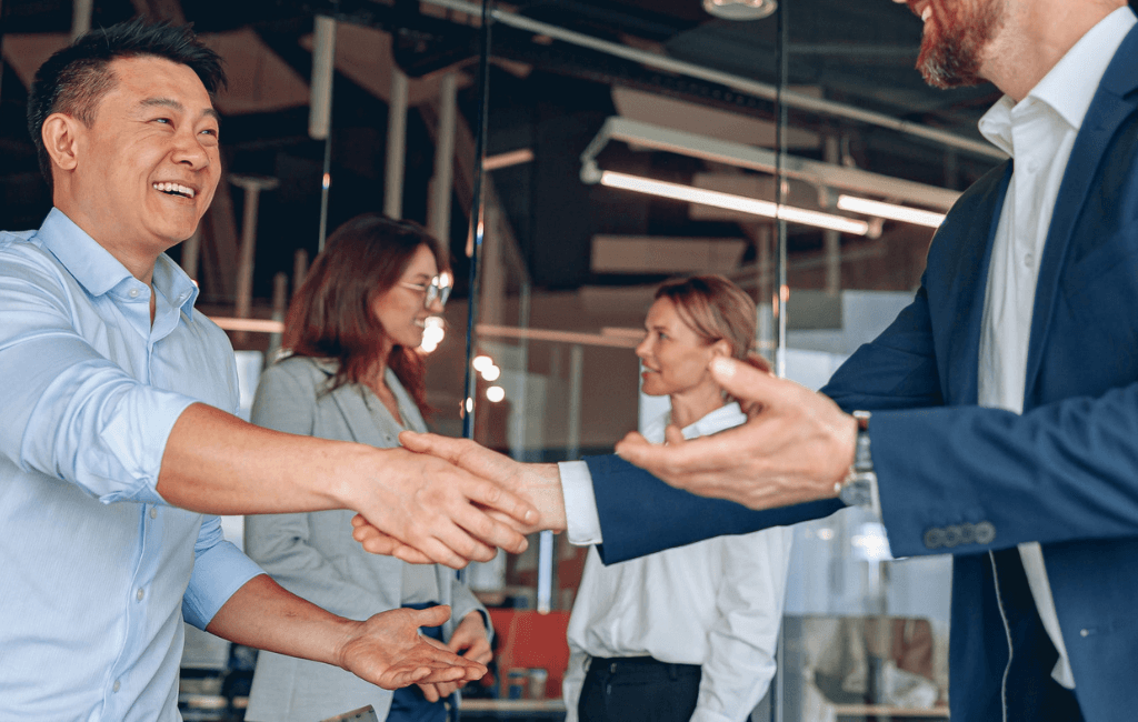 business sale agreement handshake showing valuation and CGT implications